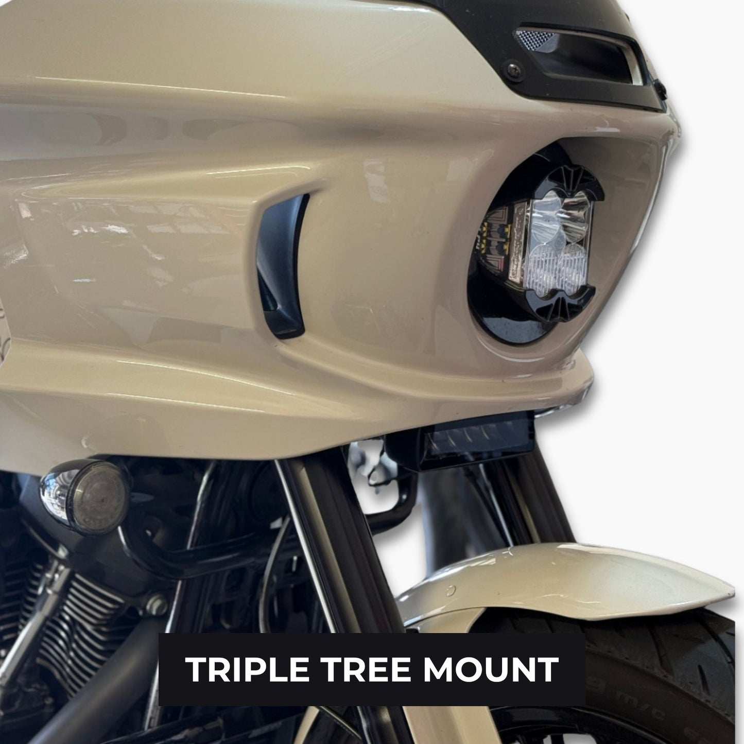 Close-up of a Low Rider ST motorcycle's Baja lp4 front headlight and light bar aux light